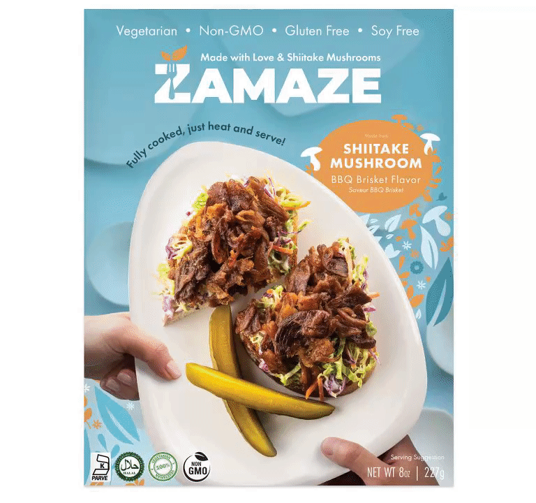 A box of Lamaze Shiitake Mushroom BBQ Brisket Flavor featuring two servings on a plate with coleslaw and pickles. The packaging highlights vegetarian, non-GMO, gluten-free benefits—perfect for fans of innovative, bottom-up marketing in food trends.