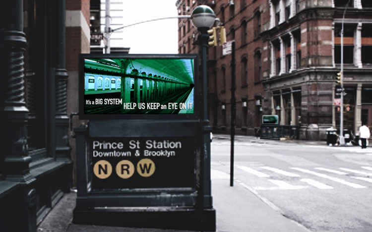 Entrance to Prince St Station in New York City with a digital sign above displaying a message about monitoring the subway system.
