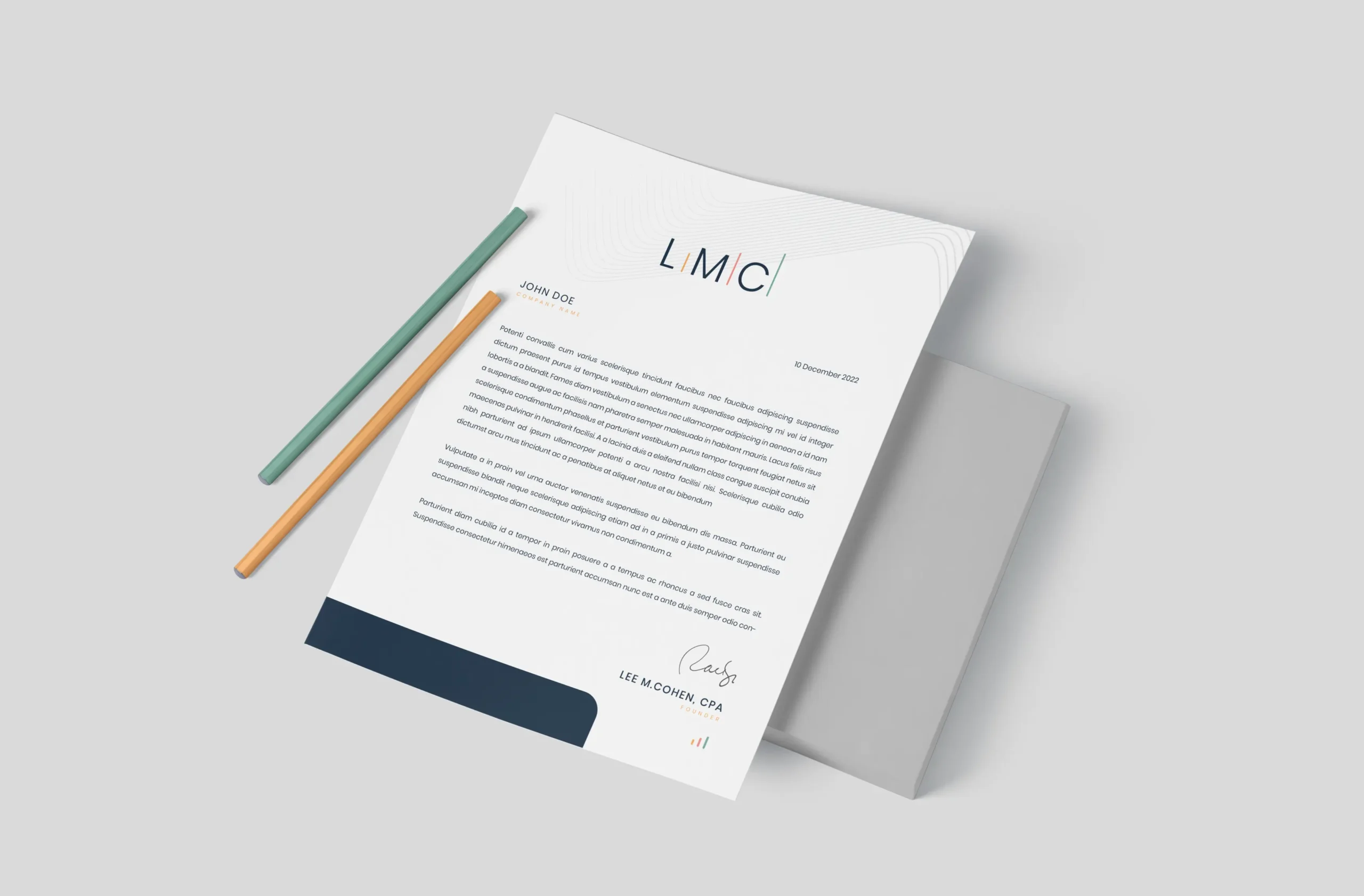 A letterhead document labeled "LMC" with text, signature, and two pencils, placed on a gray surface next to a closed folder—ideal for showcasing Small Business Branding Agency professionalism.