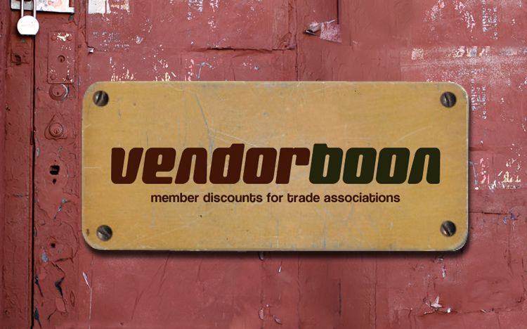A tan sign with the words “vendorboon member discounts for trade associations” hangs on a weathered, red-painted wall.