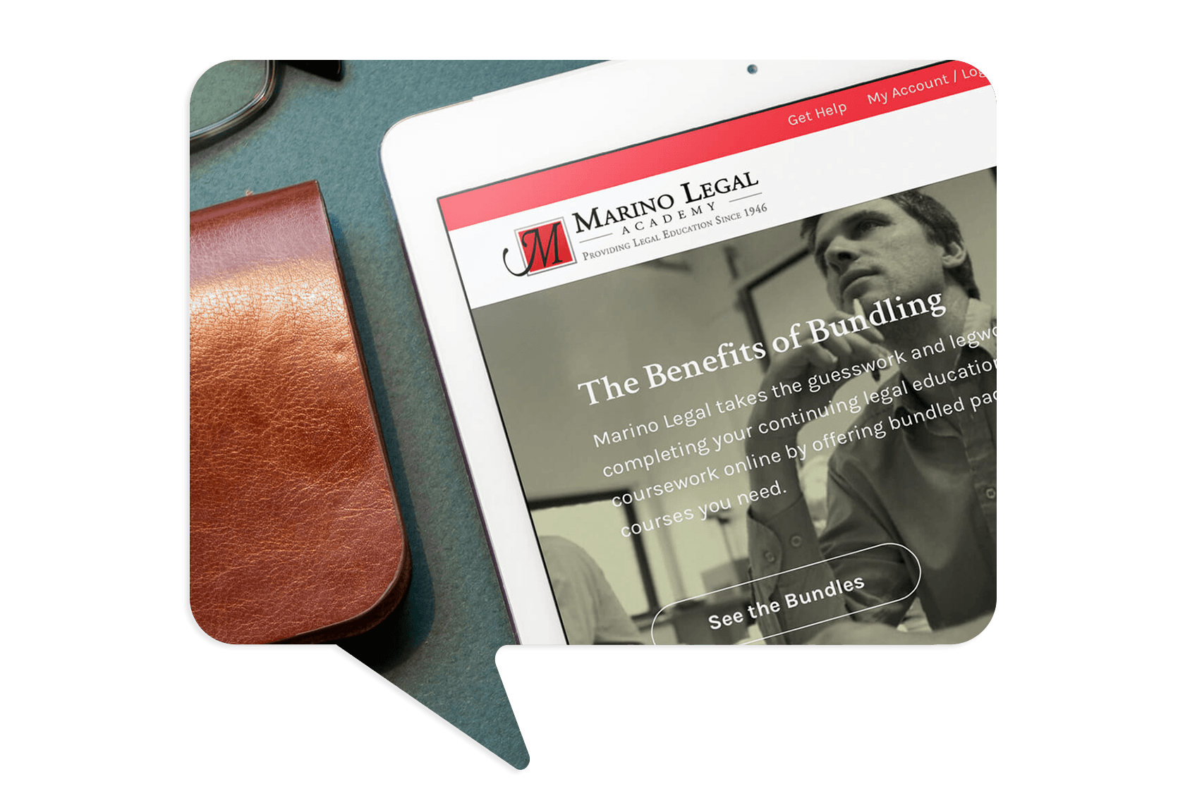 An iPad displaying the Marino Legal Academy website lies on a desk next to a brown leather case and a pair of glasses.