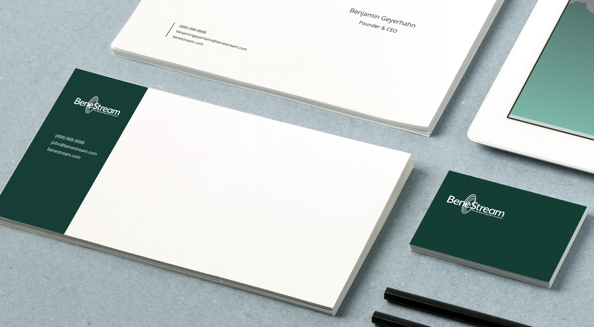 Business stationery set including letterhead, envelopes, and business cards with a green and white BareStream logo and contact information, arranged neatly on a desk.