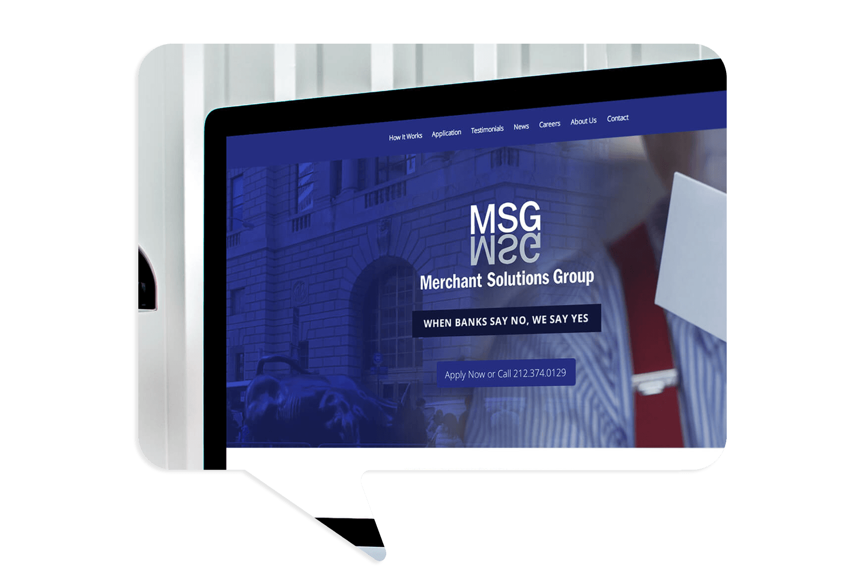 A computer screen displays the Merchant Solutions Group website with the slogan "When banks say no, we say yes" and a phone number for applications.