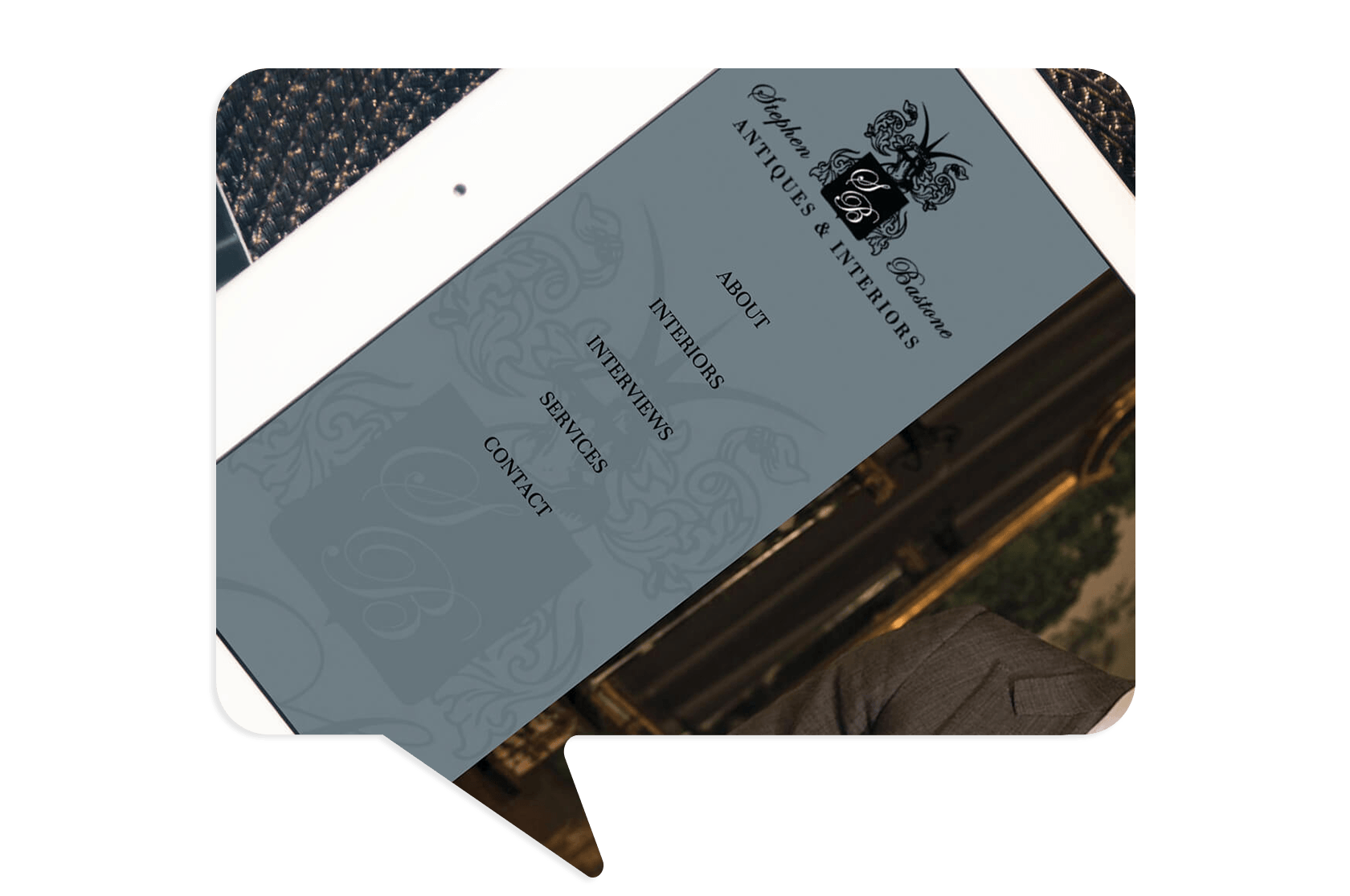 A tablet displaying a website menu for "Antiques & Interiors" with options: About, Interiors, Interviews, Services, and Contact.