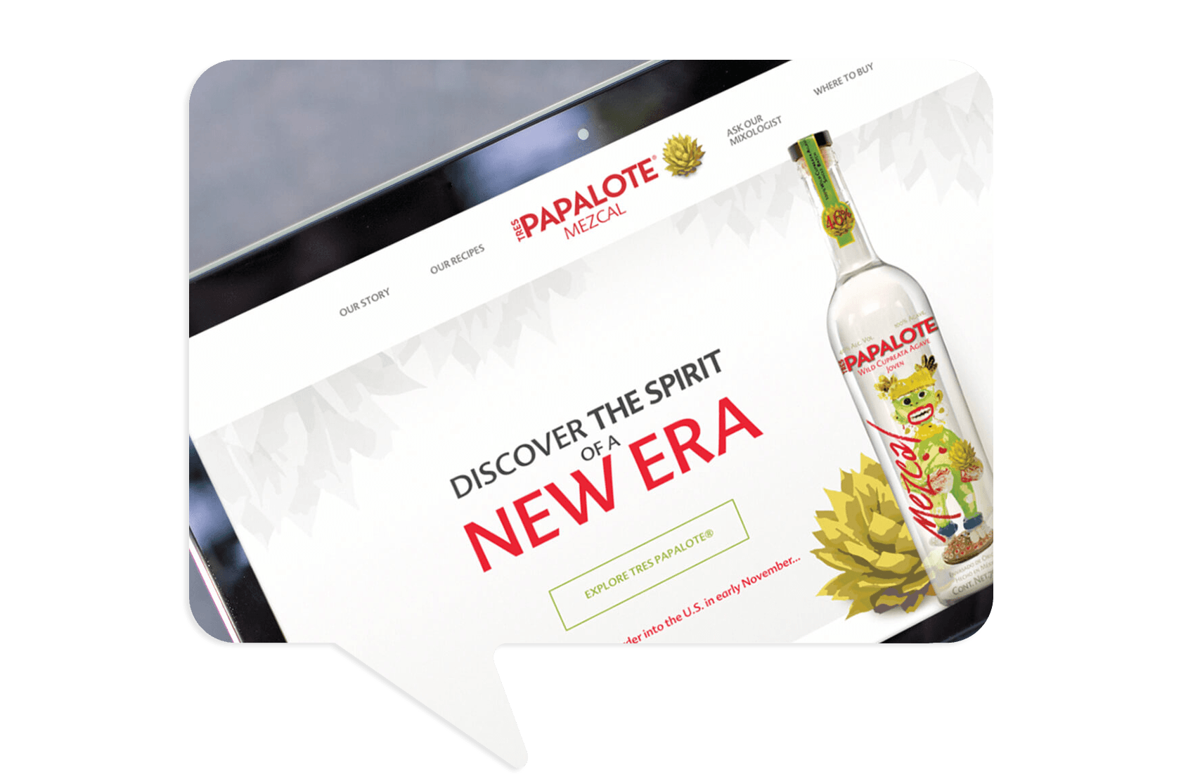A tablet displays the Papalote Mezcal website homepage with a bottle of Papalote Mezcal and the text "Discover the spirit of a new era.