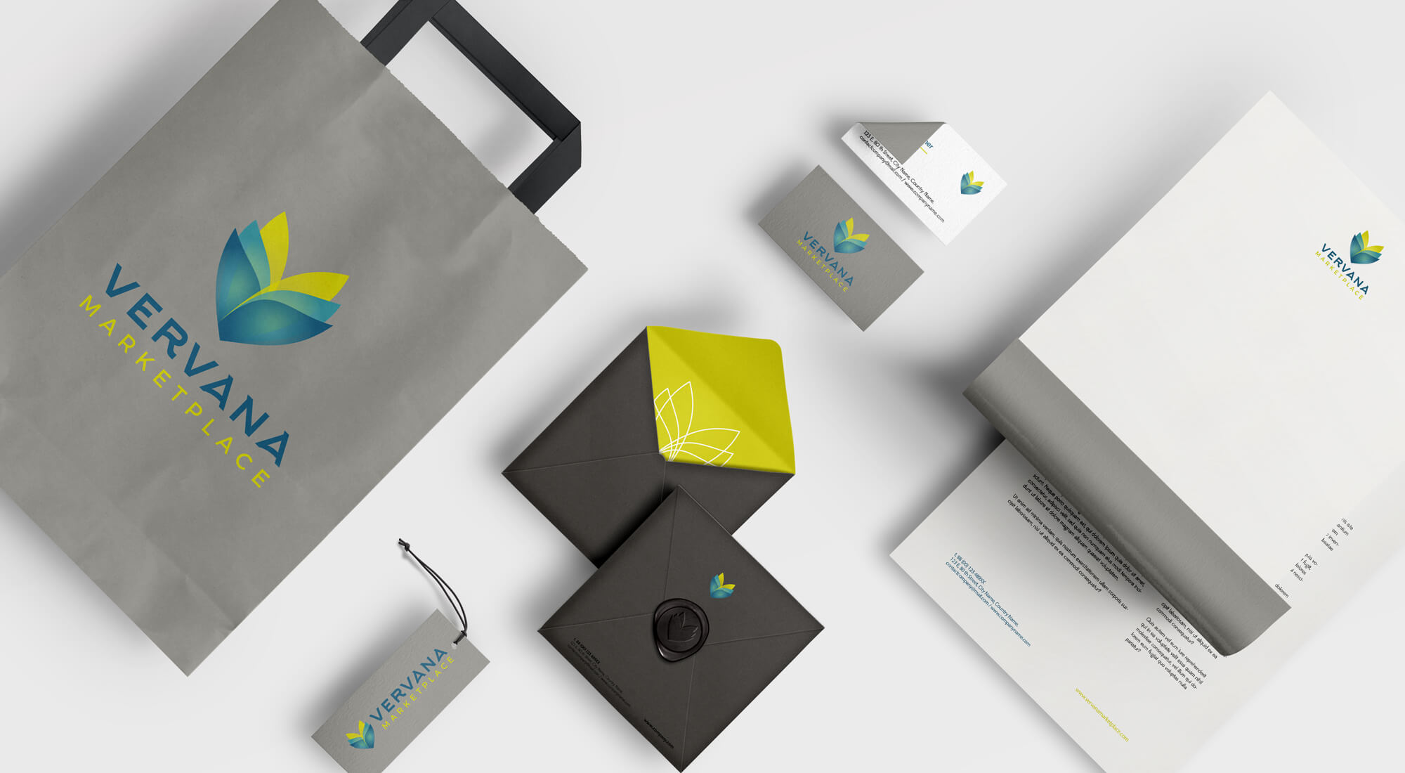Gray shopping bag, business cards, envelopes, letterhead, and a tag, all featuring the blue and yellow Vervana Marketplace logo and branding on a white background.