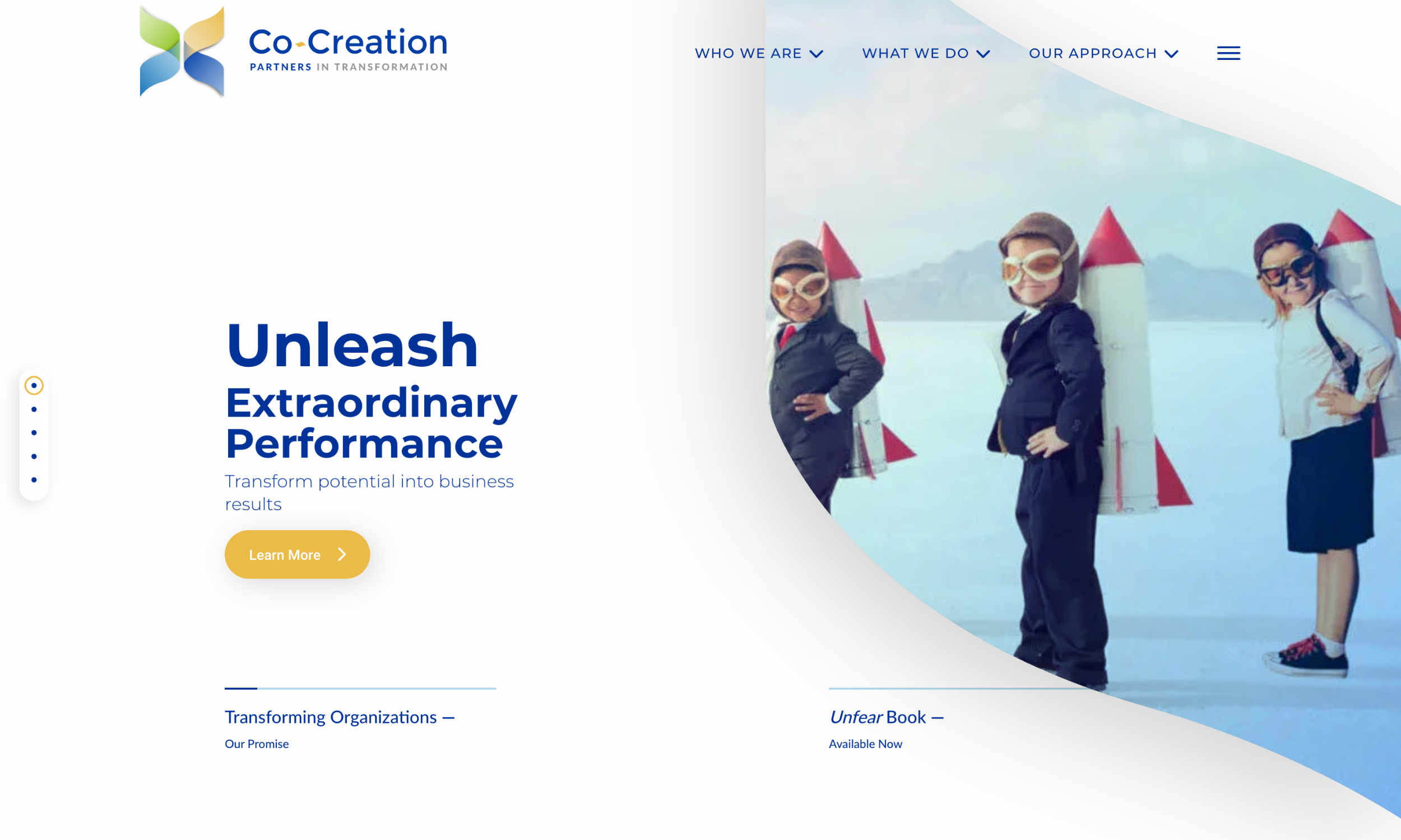 Three children wearing aviator goggles and backpacks with red rockets stand side by side, posing confidently in front of a blue background.