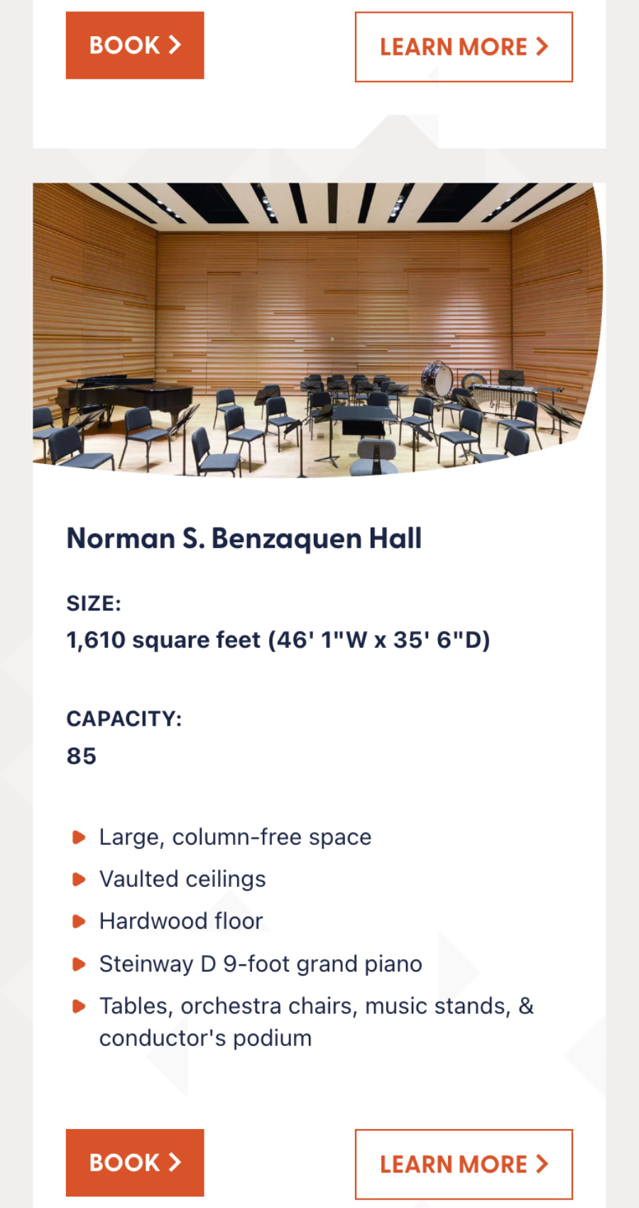 A modern music hall with wooden walls, vaulted ceilings, a grand piano, music stands, orchestra chairs, and a conductor's podium. Capacity: 85 people.