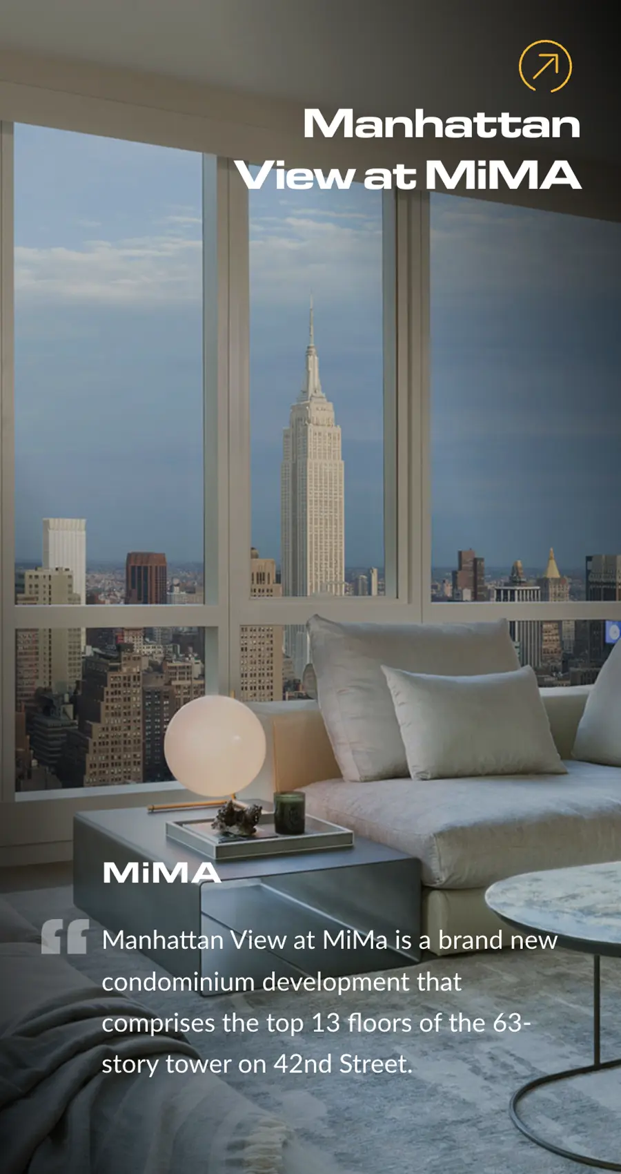 Living room with modern furnishings and large windows offering a view of the Empire State Building and Manhattan skyline at sunset. Text describes the Manhattan View at MiMA condominium.