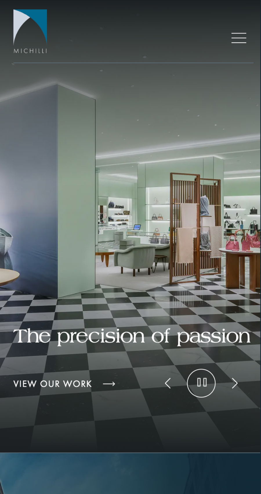 Michilli homepage hero section featuring luxury retail interior with headline and navigation.