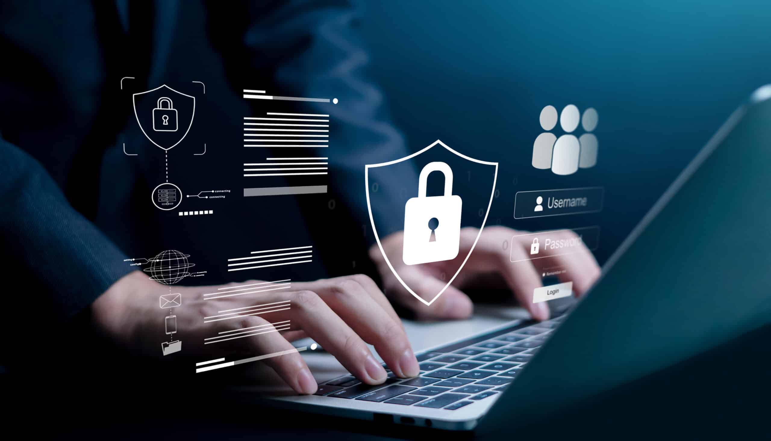 Hands typing on a laptop keyboard with digital security icons, such as a padlock and user profiles, overlaid to represent cybersecurity and data protection.